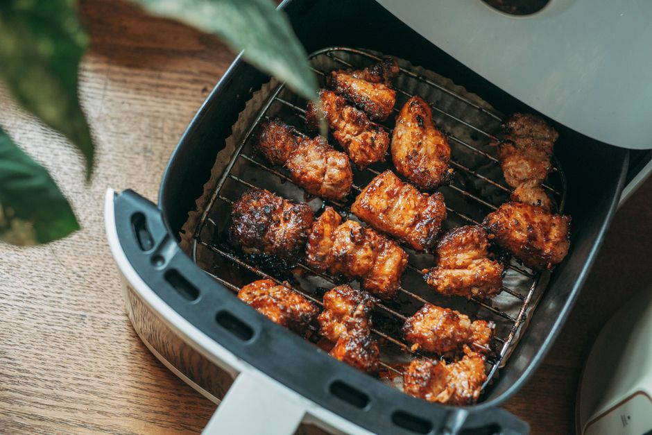 An air fryer basket filled with crispy golden food