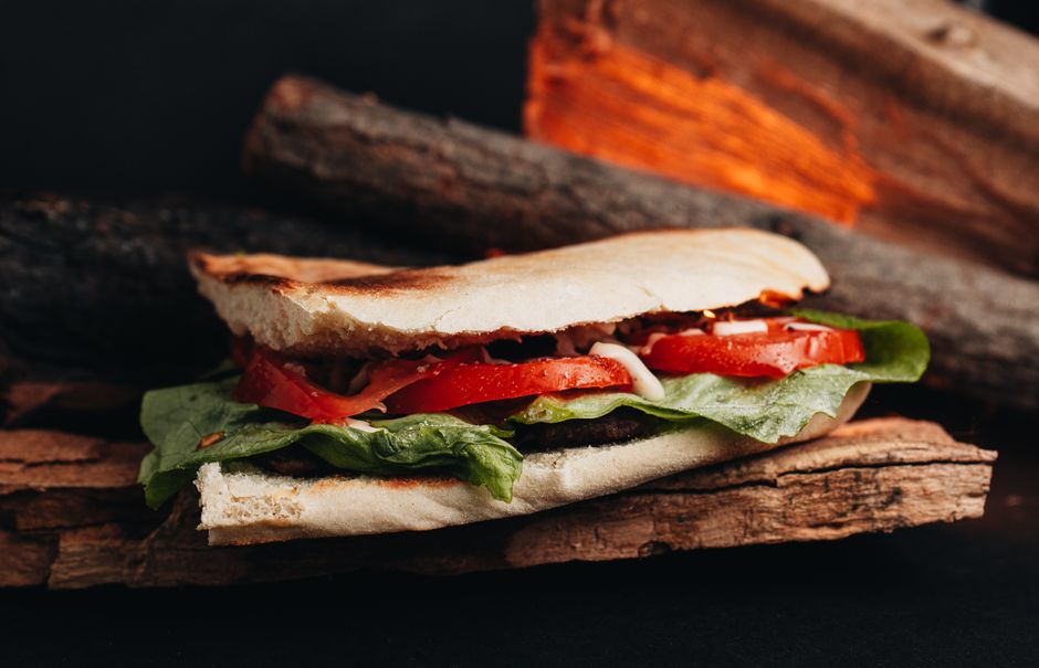 A Caprese sandwich with fresh mozzarella, tomato, and basil