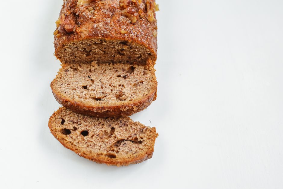 Close-up of freshly baked banana bread slices showcasing rich, nutty texture.