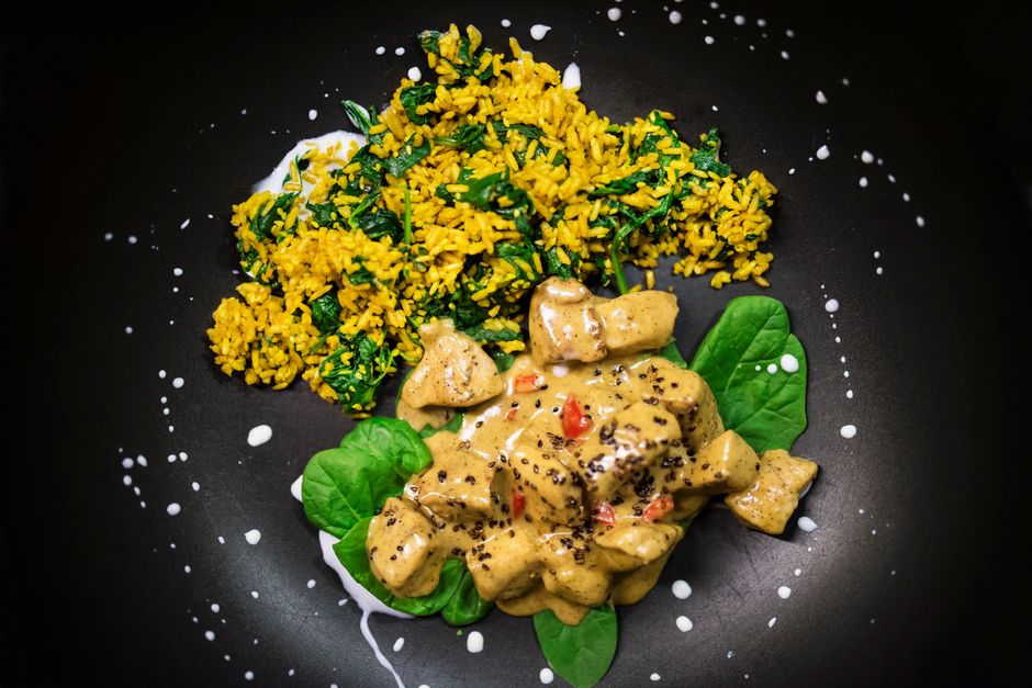 Creamy Tuscan chicken with spinach and sun-dried tomatoes in a skillet