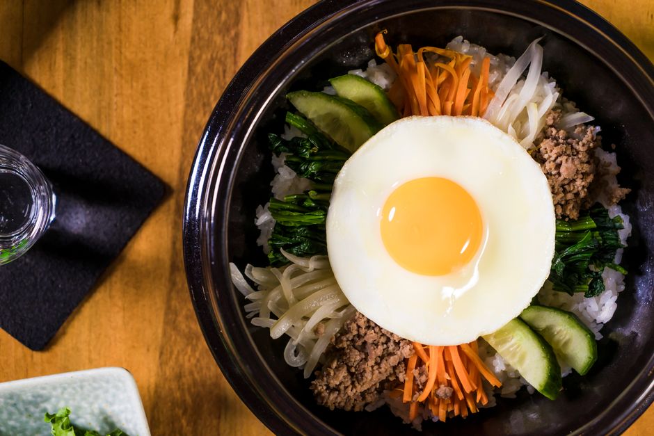 Korean ground beef bowl served over white rice with sesame seeds and green onions