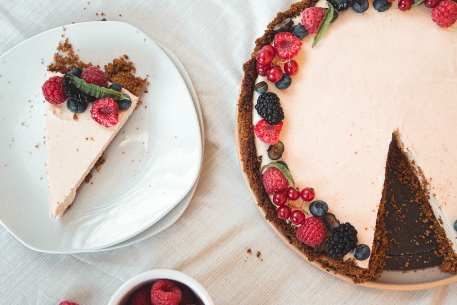 A slice of no-bake cheesecake topped with fresh berries