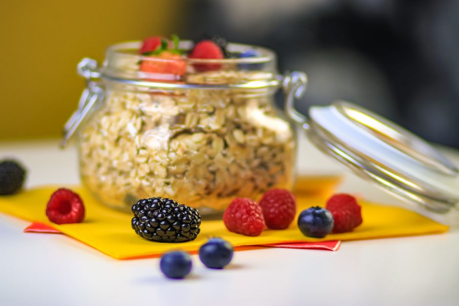 Mason jars of overnight oats topped with fresh berries