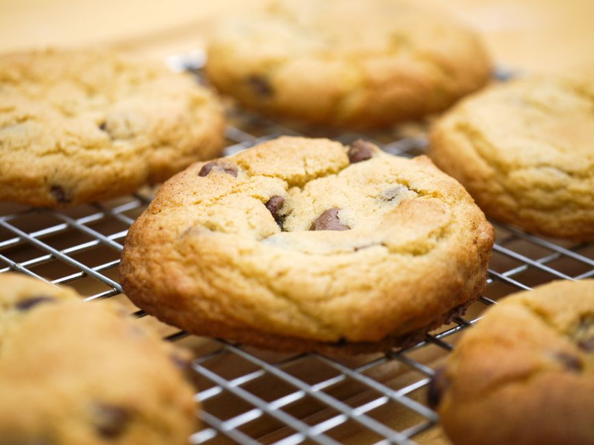 A stack of soft chocolate chip cookies with melty chocolate