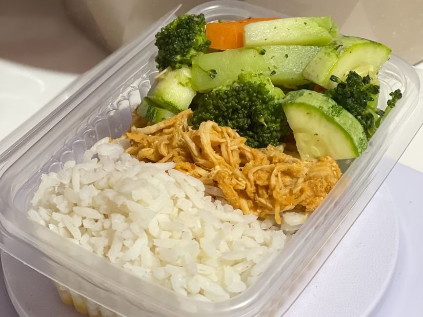 Chicken, rice, and roasted vegetables portioned into meal prep containers