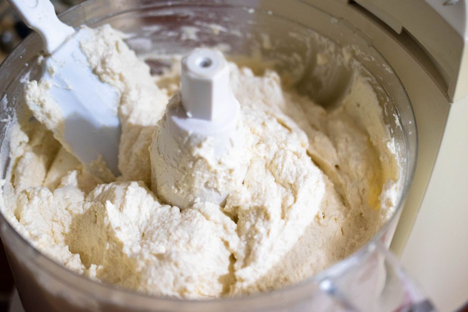 pouring smooth cottage cheese mixture into loaf pan before freezing