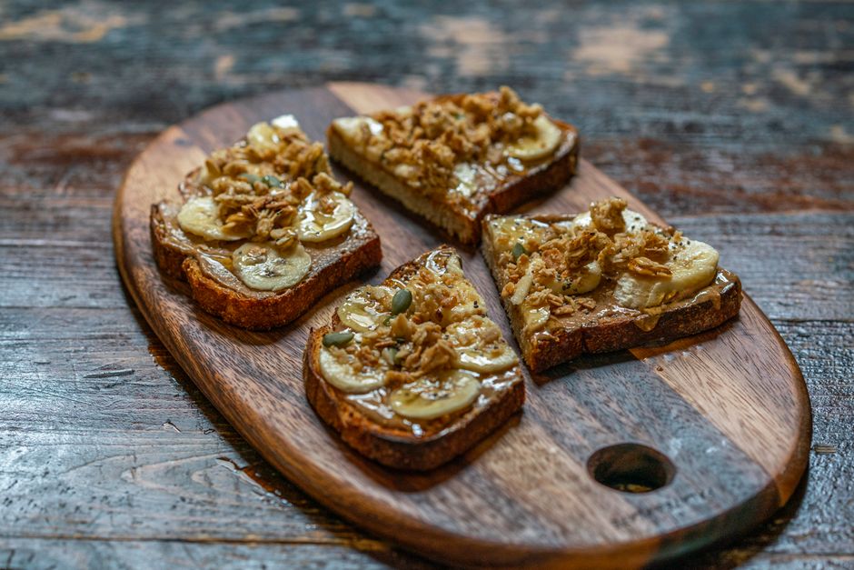 Toasted slice of banana bread with a pat of melting butter on top