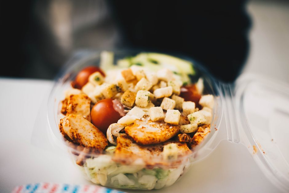 meal prep containers with chicken salad and vegetables