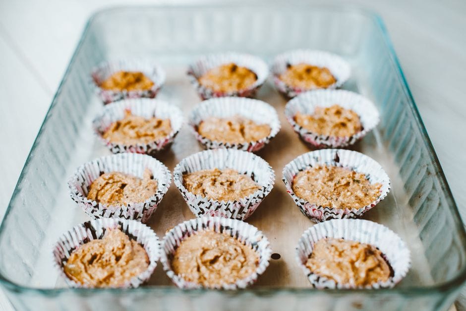 Delicious homemade muffins in cupcake liners ready for baking. Perfect for a fresh dessert.